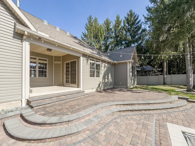 view of patio / terrace featuring fence