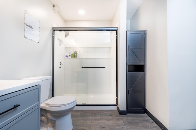 11181 Elm St, Lakeview, OH 43331 - bathroom with wood finished floors, a shower stall, toilet, and vanity