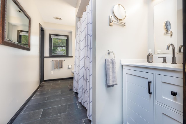 11181 Elm St, Lakeview, OH 43331 - full bathroom with vanity, baseboards, and tile patterned floors