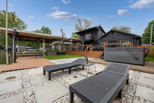11181 Elm St, Lakeview, OH 43331 - view of patio featuring a hot tub and a deck