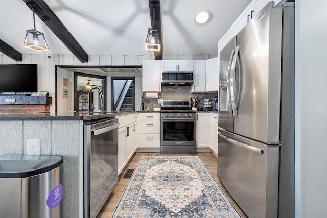11181 Elm St, Lakeview, OH 43331 - kitchen with appliances with stainless steel finishes, light wood-style floors, a sink, decorative backsplash, and white cabinetry