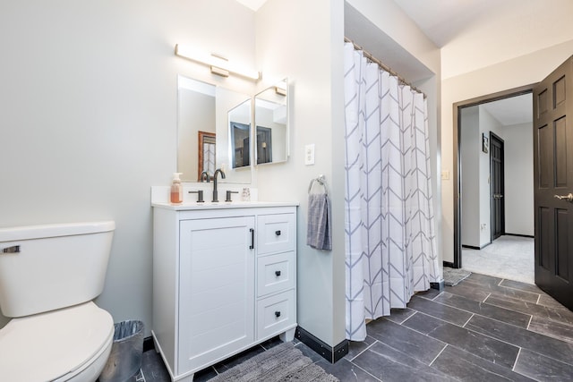 11181 Elm St, Lakeview, OH 43331 - full bath featuring toilet, vanity, and baseboards