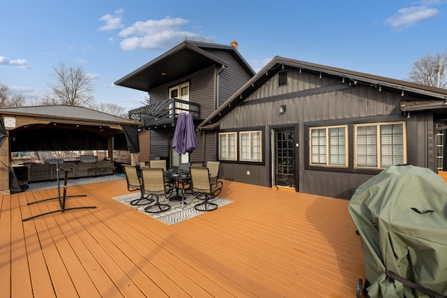 wooden deck featuring a gazebo and grilling area