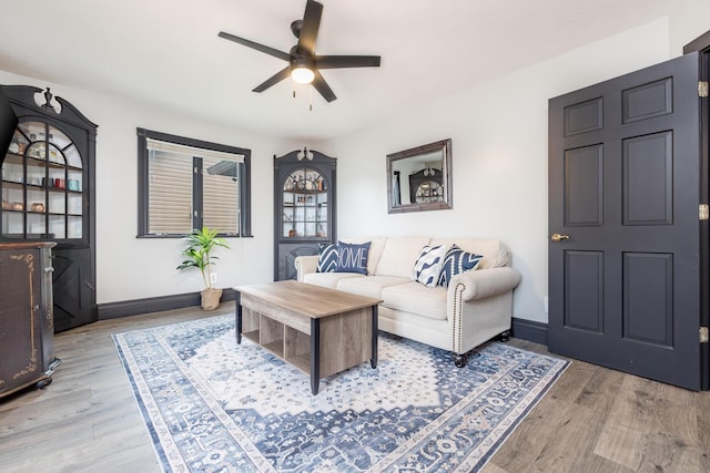 11181 Elm St, Lakeview, OH 43331 - living room with a ceiling fan, light wood finished floors, and baseboards