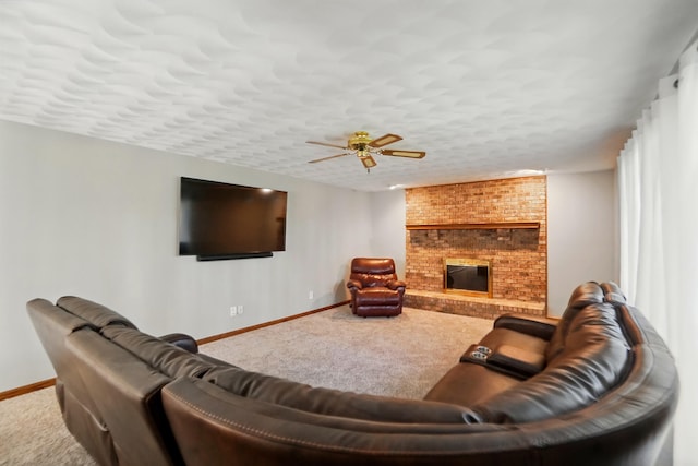 carpeted living area with a brick fireplace, a textured ceiling, baseboards, and ceiling fan