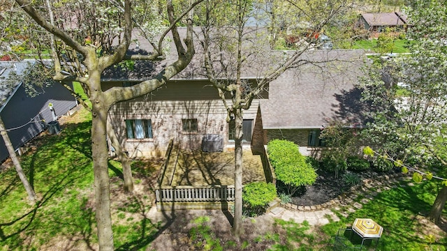 exterior space featuring brick siding and fence