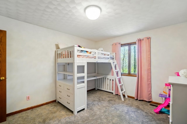 carpeted bedroom with baseboards