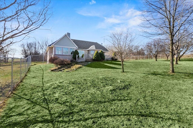 view of side of property featuring a yard