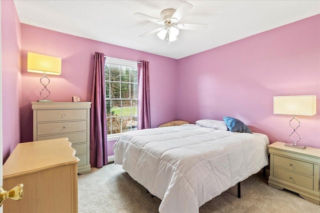 bedroom featuring ceiling fan and light colored carpet