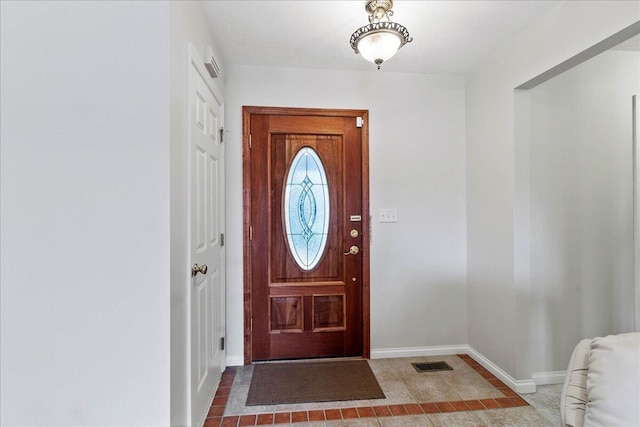 foyer with tile patterned flooring