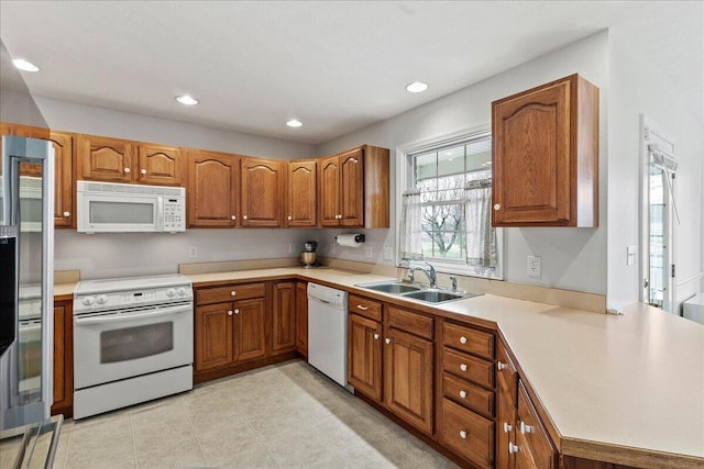 kitchen with white appliances and sink