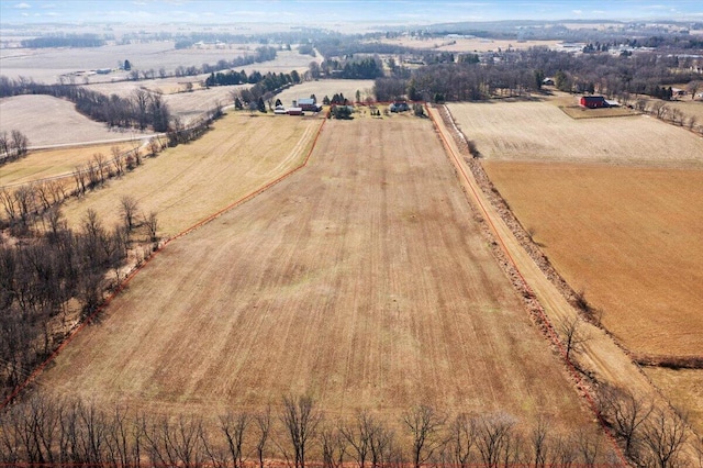 birds eye view of property with a rural view