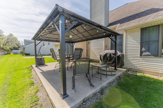 view of patio with a gazebo and a grill