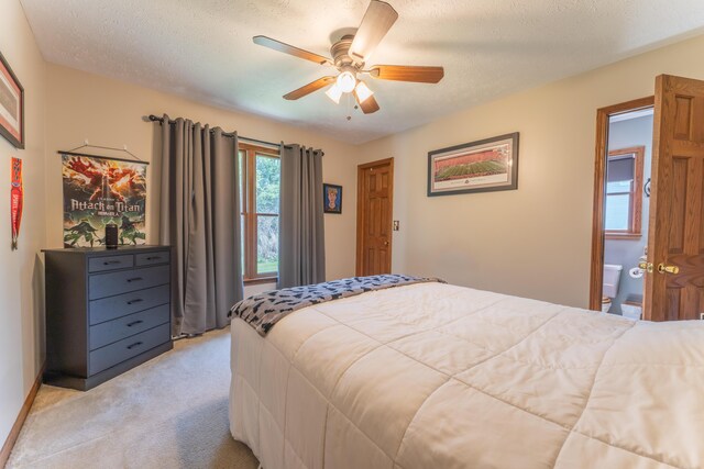 bedroom featuring a ceiling fan and light colored carpet