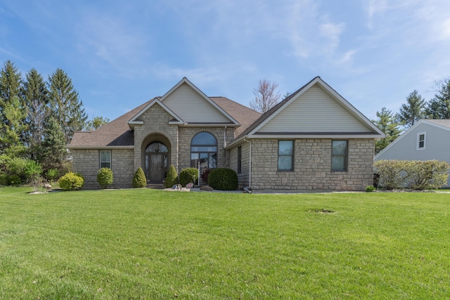 view of front of property with stone siding and a front yard