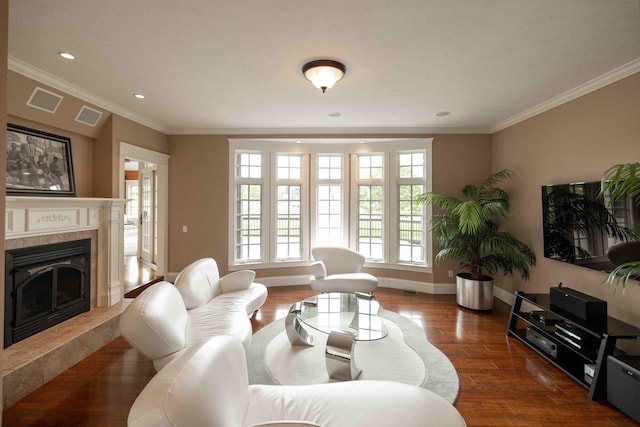 429 Braytonburne Dr, Springfield, OH 45503 - living area featuring a high end fireplace, wood finished floors, baseboards, ornamental molding, and recessed lighting