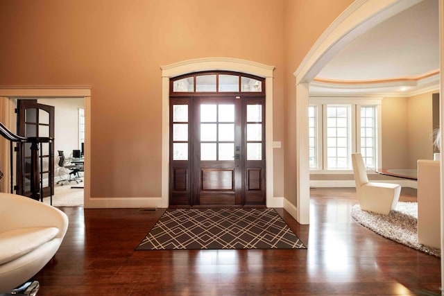 429 Braytonburne Dr, Springfield, OH 45503 - entrance foyer with baseboards, dark wood-style floors, ornamental molding, and a tray ceiling