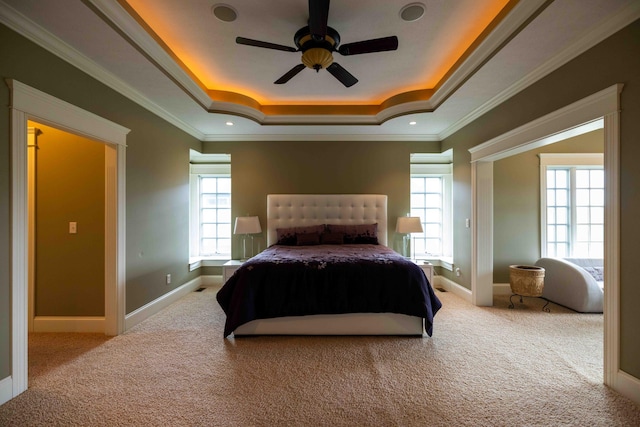 429 Braytonburne Dr, Springfield, OH 45503 - carpeted bedroom featuring a tray ceiling, baseboards, ornamental molding, and a ceiling fan