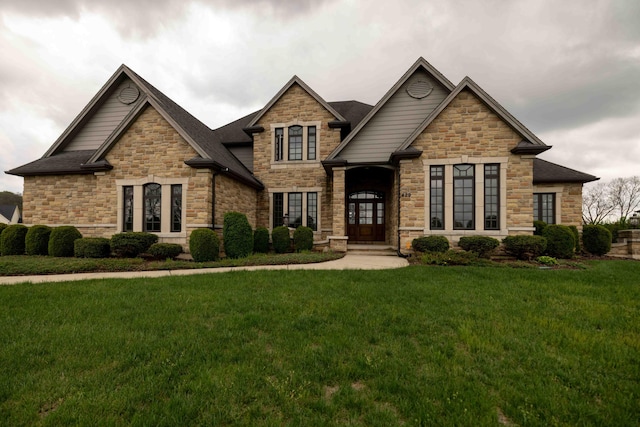 429 Braytonburne Dr, Springfield, OH 45503 - craftsman-style house with a front lawn, stone siding, and roof with shingles