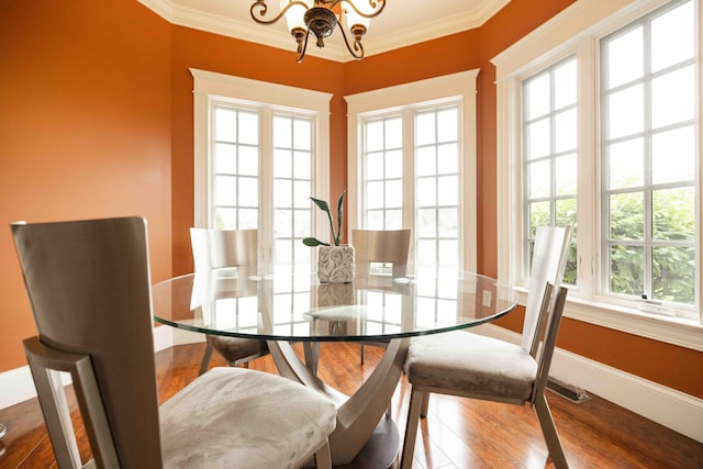 429 Braytonburne Dr, Springfield, OH 45503 - dining area featuring a chandelier, plenty of natural light, ornamental molding, wood finished floors, and baseboards