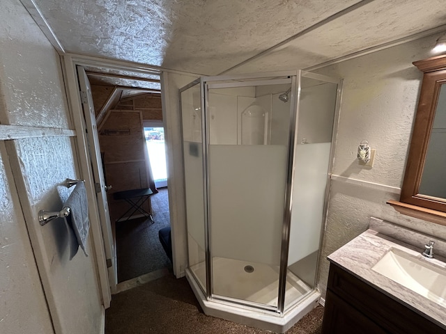 11240 Mohawk Path, Lakeview, OH 43331 - bathroom with a textured wall, a stall shower, vanity, and a textured ceiling
