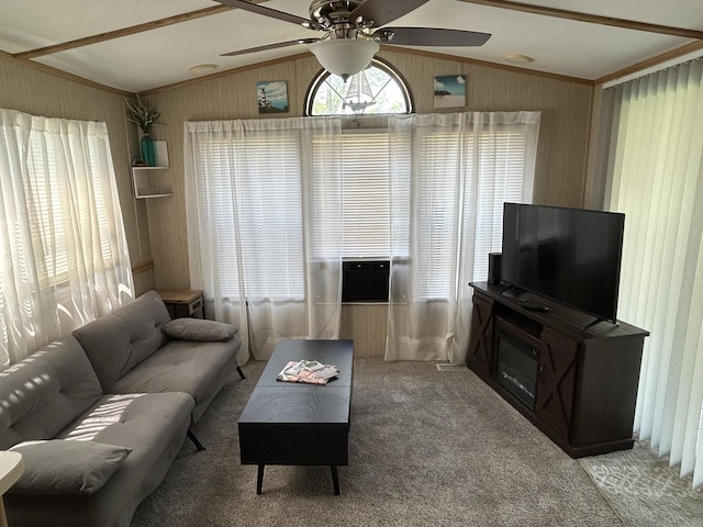 11240 Mohawk Path, Lakeview, OH 43331 - living room featuring vaulted ceiling, healthy amount of natural light, carpet flooring, a ceiling fan, and wood walls