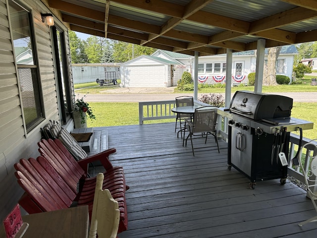 11240 Mohawk Path, Lakeview, OH 43331 - deck featuring a grill, a lawn, and an outbuilding