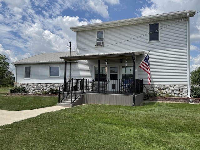 5062 Mercer Van Wert County Line Rd, Rockford, OH 45882 - view of front of home with a front yard, a metal roof, stone siding, cooling unit, and covered porch