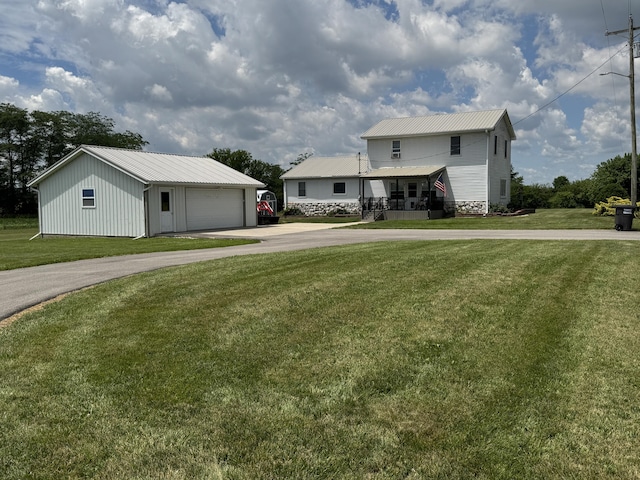 5062 Mercer Van Wert County Line Rd, Rockford, OH 45882 - view of front of home with an outdoor structure, a front lawn, a garage, and a metal roof
