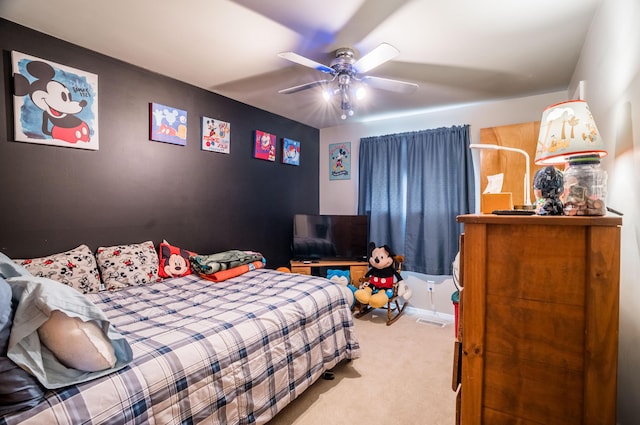 bedroom with carpet, visible vents, and ceiling fan