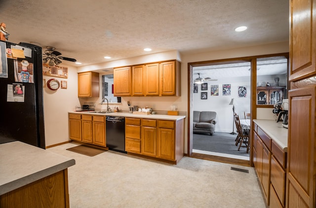 kitchen with ceiling fan, a textured ceiling, and black appliances