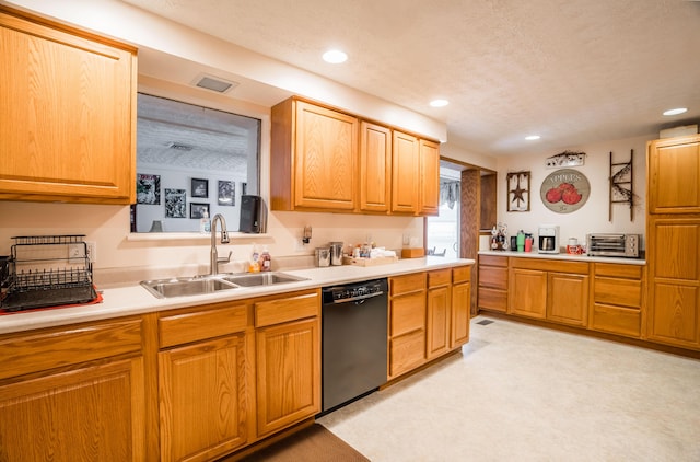 kitchen with recessed lighting, light countertops, visible vents, a sink, and dishwasher