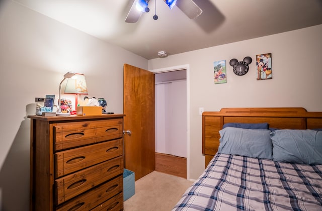 carpeted bedroom with a ceiling fan