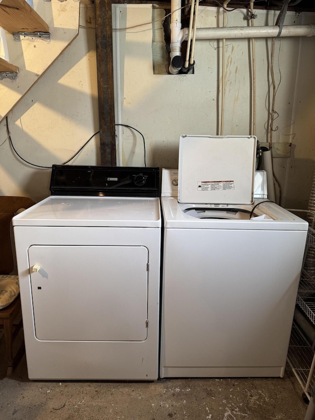 laundry area with independent washer and dryer