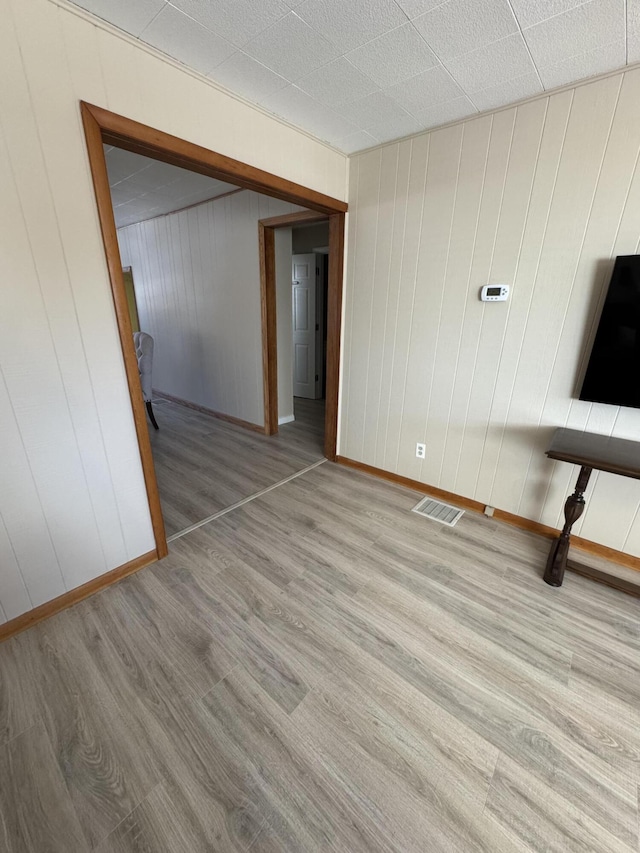 unfurnished living room with light hardwood / wood-style floors