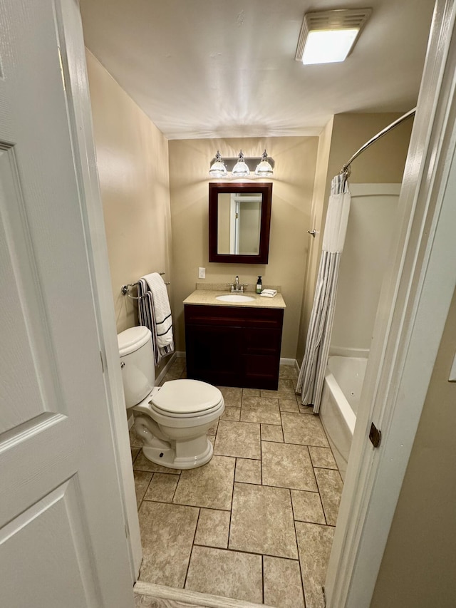 full bathroom with vanity, shower / bath combo with shower curtain, and toilet