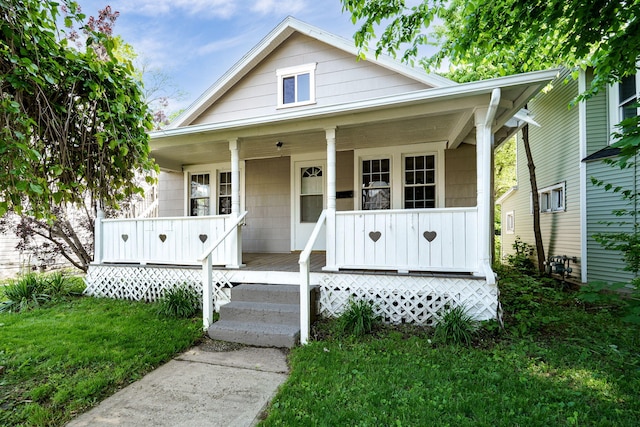 1704 Highland Ave, Springfield, OH 45503 - bungalow-style house featuring a porch and a front yard