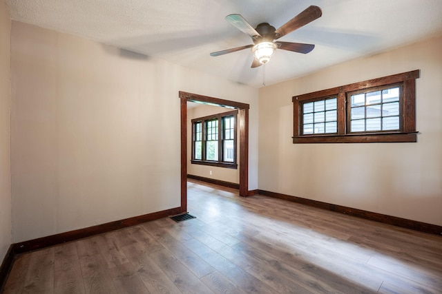 1704 Highland Ave, Springfield, OH 45503 - unfurnished room with baseboards, ceiling fan, and wood finished floors