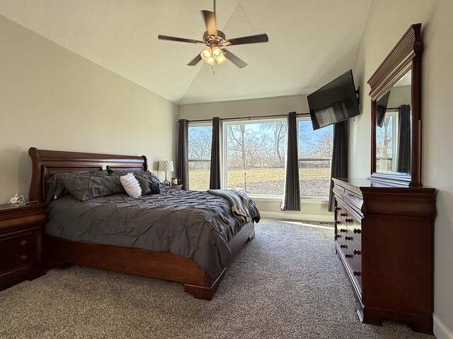 carpeted bedroom with baseboards, lofted ceiling, and ceiling fan