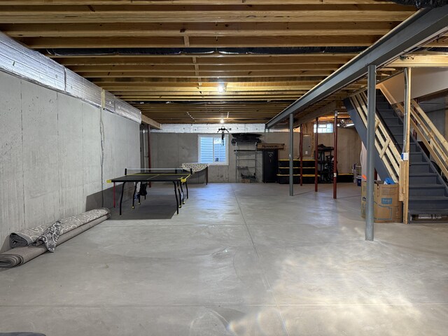 basement featuring stairs