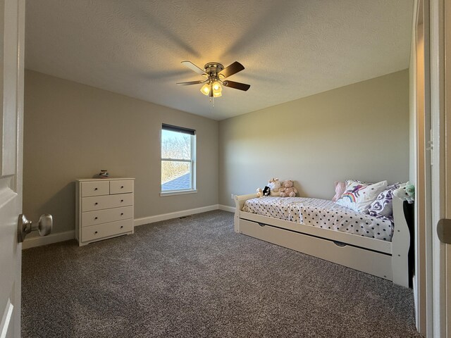 bedroom with carpet, baseboards, ceiling fan, and a textured ceiling