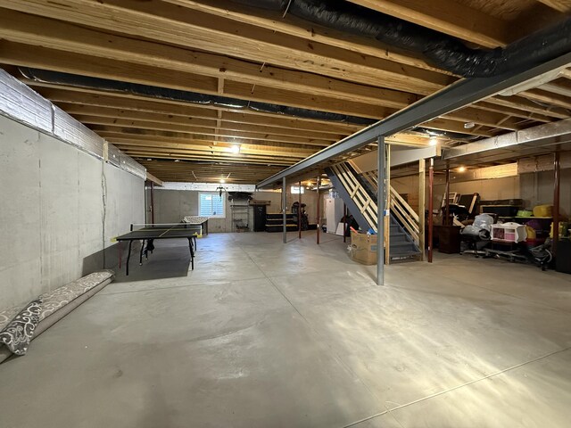basement featuring stairs