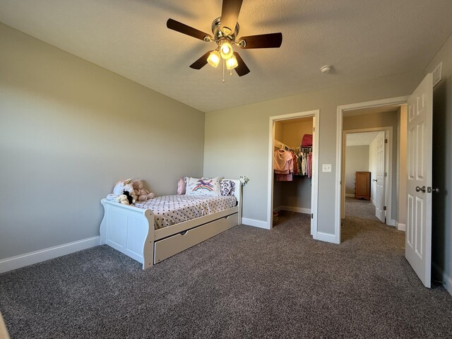 bedroom featuring visible vents, carpet, baseboards, and a textured ceiling