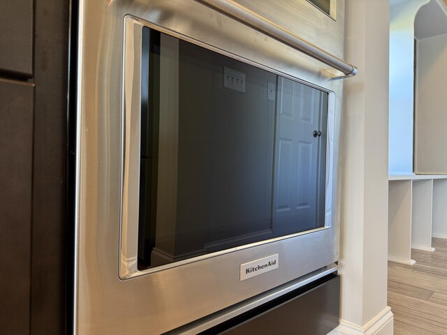 room details featuring baseboards and light wood-style floors