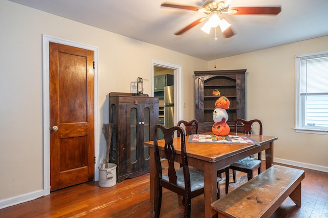 dining area featuring dark hardwood / wood-style floors and ceiling fan