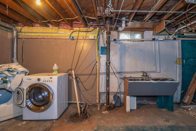 laundry area with sink and washer and clothes dryer