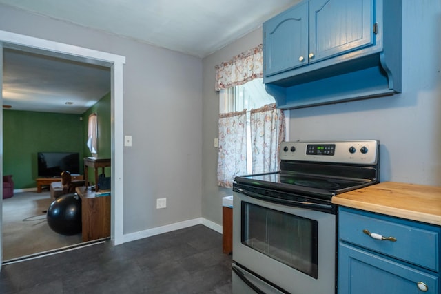 kitchen featuring stainless steel electric stove and blue cabinets