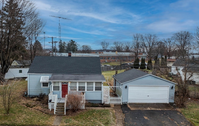 view of front of home with an outbuilding and a garage