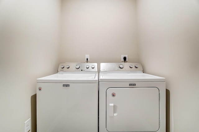 laundry area with washing machine and dryer