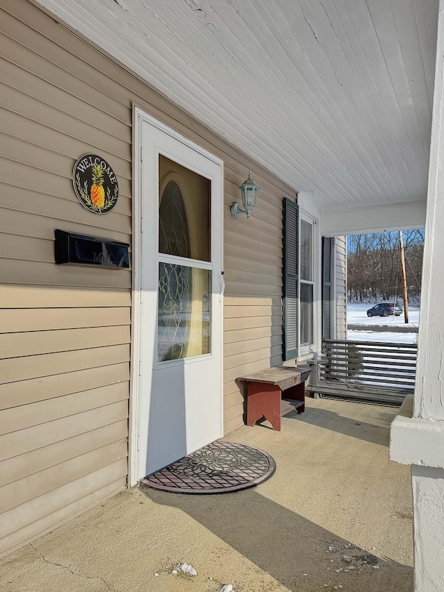 entrance to property with covered porch